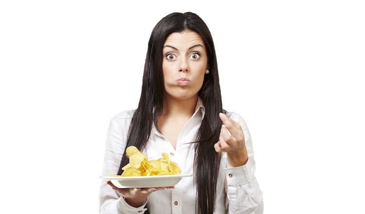 Girl eating greasy potato chips