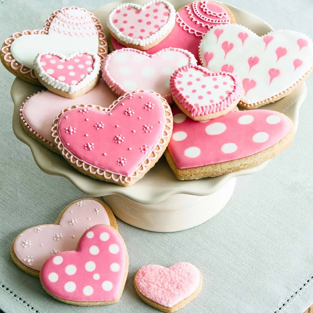 Cake stand filled with Valentine cookies