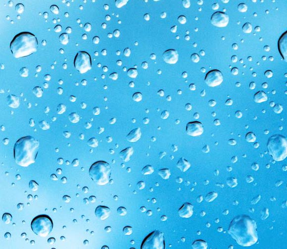 Blue background flecked with water droplets