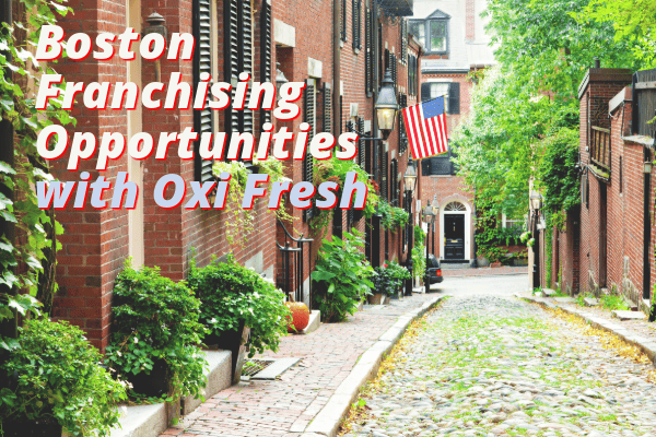 This image features a Boston street with an American flag and the overlaid words "Boston Franchising Opportunities with Oxi Fresh."