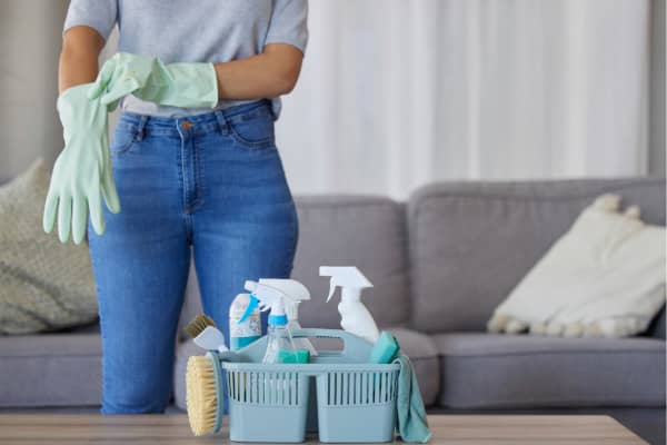 A woman gets ready for spring cleaning in her home.